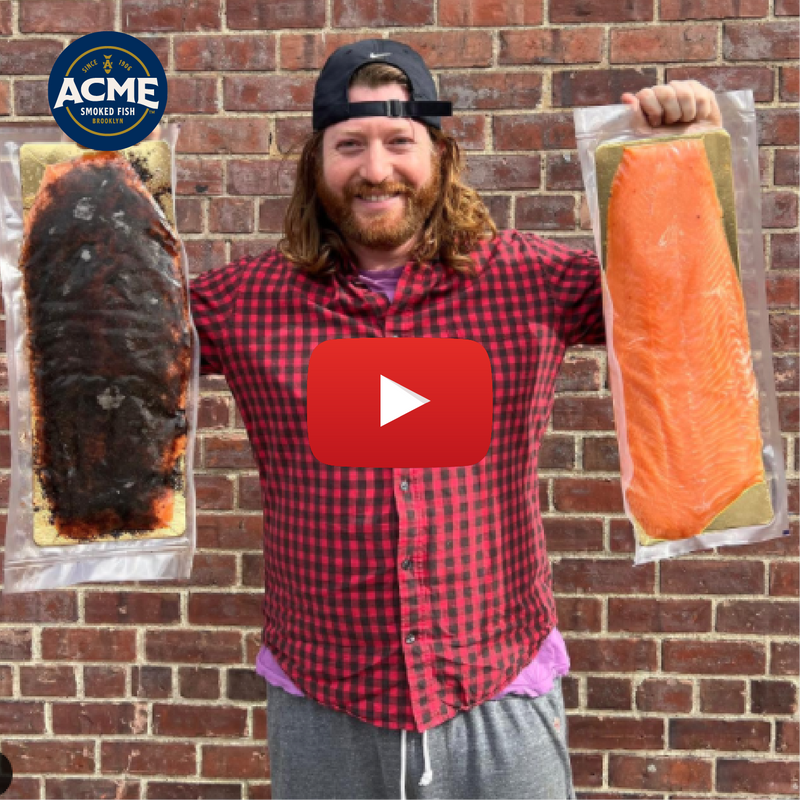 man holding smoked salmon