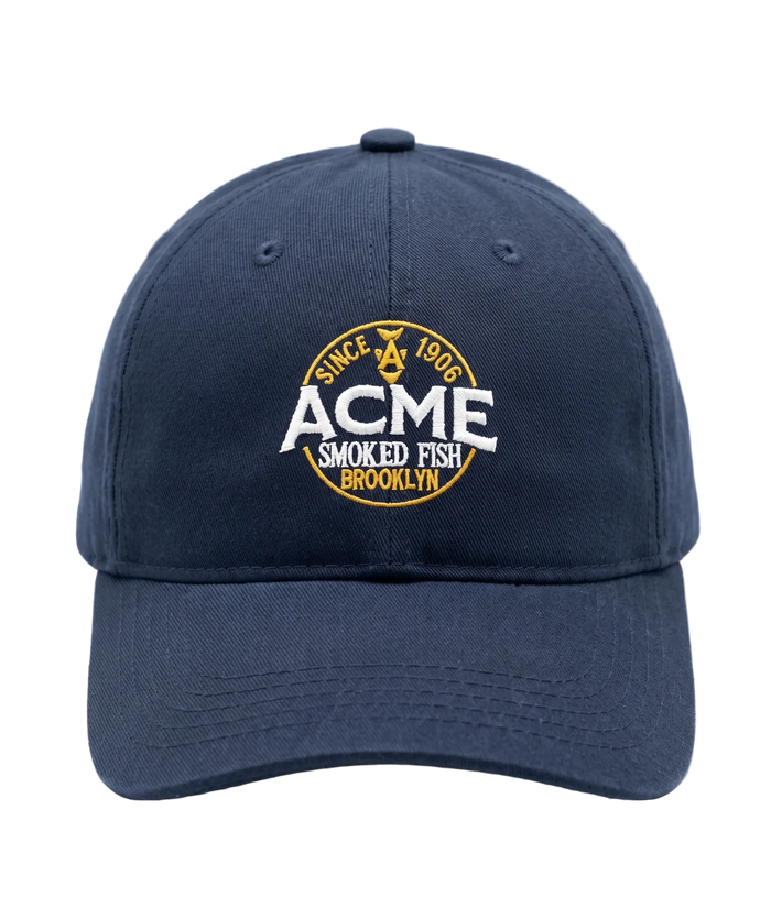 Navy blue cap with Acme Smoked Fish Brooklyn logo on a white background